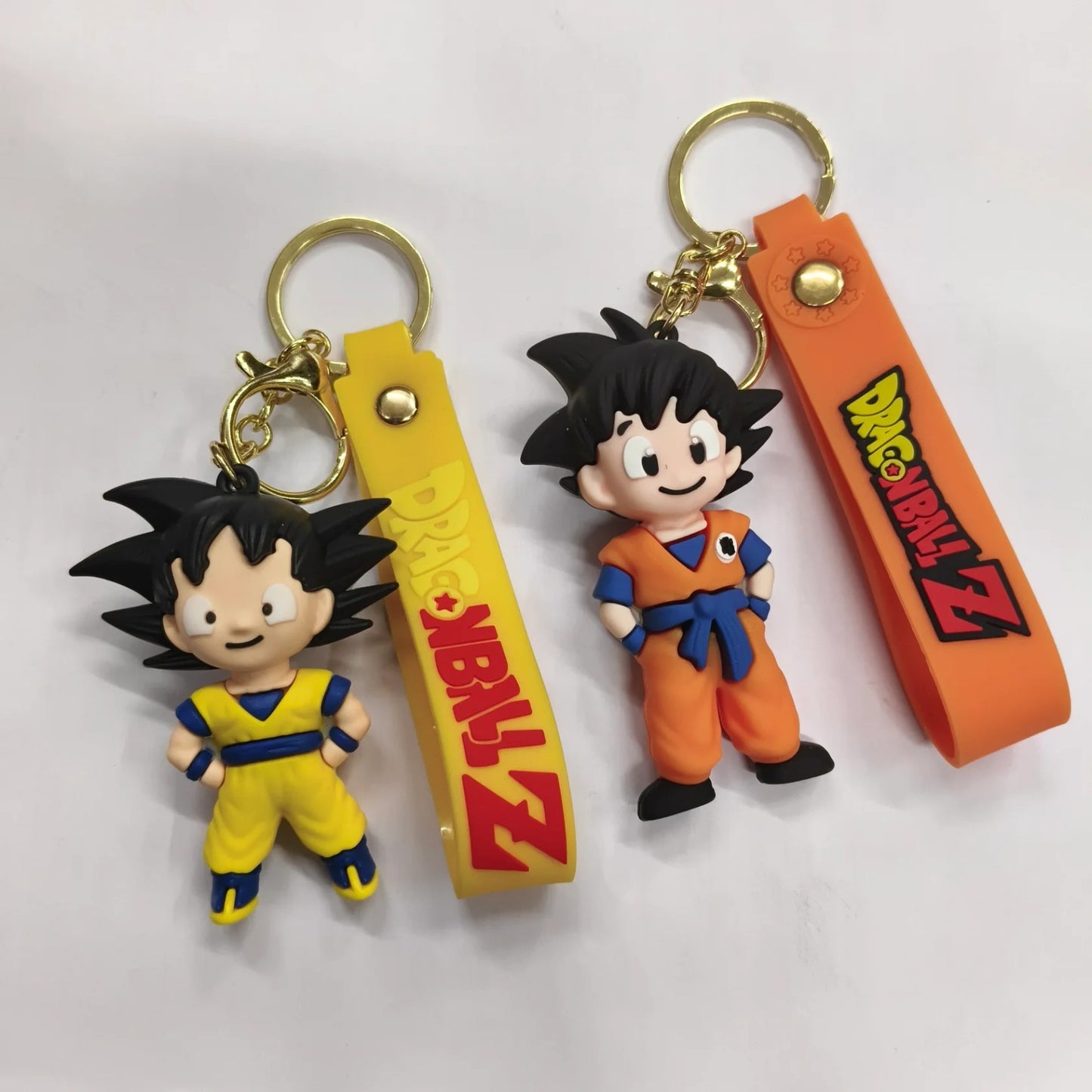 Dragon Ball Z Goku Cartoon Keychain Set with Logo Strap – Anime Character Rubber Keyring (Pack of 2)