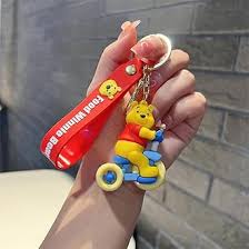Cute Bear Keychain with Red Strap – Cartoon Character on Tricycle