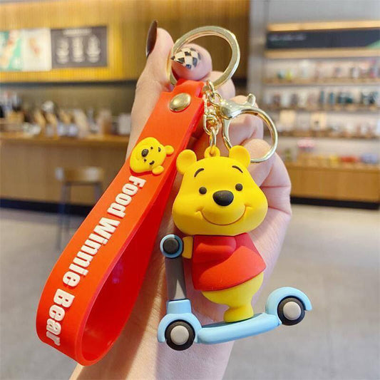 Cute Bear Keychain with Red Strap – Cartoon Character on Tricycle
