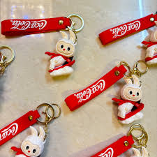 Coca-Cola Bunny Keychain – Cute Cartoon Character with Red Strap 🐰🥤